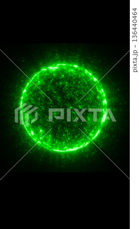 Glowing green energy sphere made of dynamic particles floating in darkness, symbolizing power and transformation 136440464