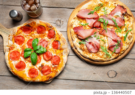 Two Italian pizza on wooden background Two Italian pizza on wooden background 136440507