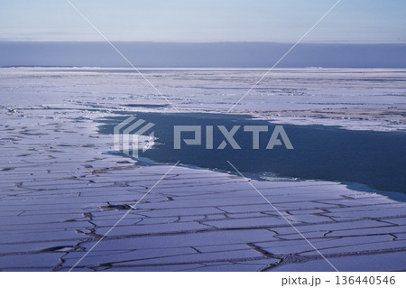 Frozen Arctic Waters Revealing Melt Pools Amidst Fragmented Ice Sheets Frozen Arctic Waters Revealing Melt Pools Amidst Fragmented Ice Sheets 136440546