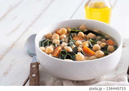 Chickpea and Spinach Soup with Carrots in White Bowl Chickpea and Spinach Soup with Carrots in White Bowl 136440733