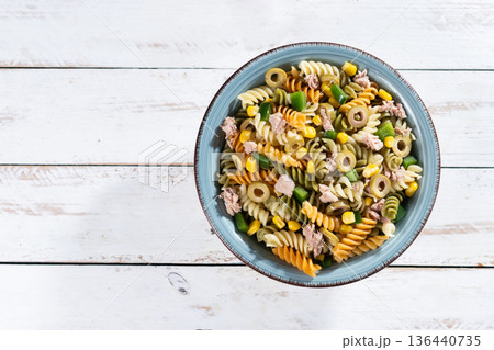 Pasta salad with tuna, corn and olives in bowl 136440735