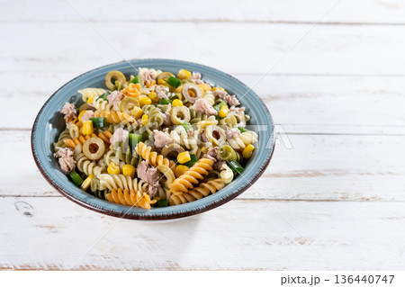 Pasta salad with tuna, corn and olives in bowl 136440747