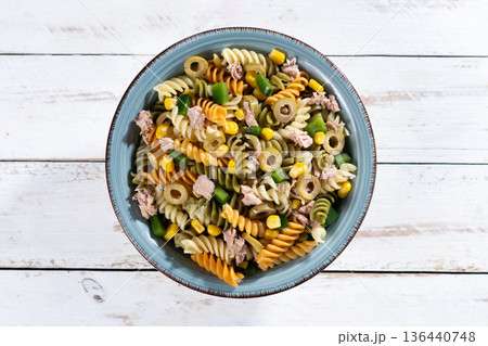 Pasta salad with tuna, corn and olives in bowl 136440748
