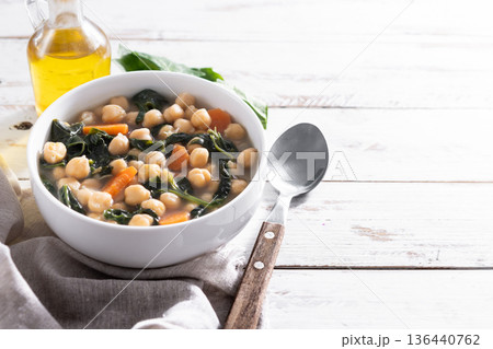 Chickpea and Spinach Soup with Carrots in White Bowl Chickpea and Spinach Soup with Carrots in White Bowl 136440762