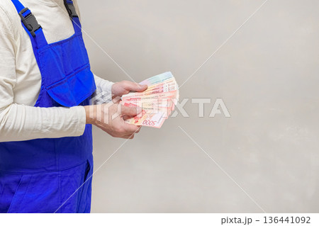 Close up the worker hands with money. Copy space. Close up the worker hands with money. Copy space. 136441092