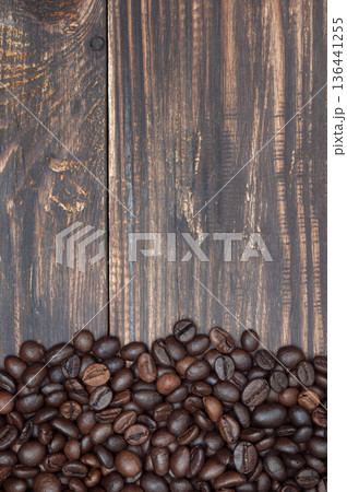 close up coffee beans on wooden background, top view, copyspace 136441255