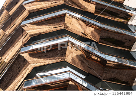 Vessel building in Hudson Yards in New York City. Modern architecture building Vessel spiral staircase. Hudson Yards in New York. The Vessel. Modern Art staircase in Manhattan 136441994