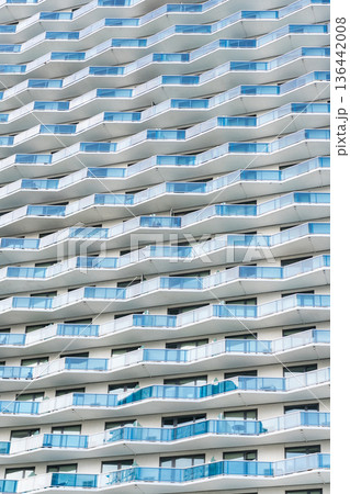 Architectural detail. Background of architecture. Modern glass background. Glass facade background. Architecture. Building facade architecture. Building background. Glass building balcony 136442008