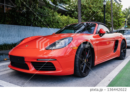 Miami Beach, Florida USA - June 9, 2024: 2018 Porsche 718 Boxter s orange color at miami beach. luxury car porshche at ocean drive Miami beach. front corner view 136442022