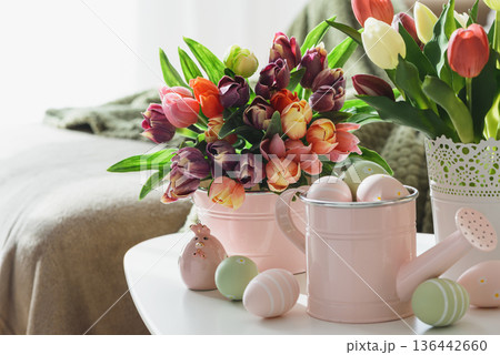 Easter Table with Tulip Bouquets, Eggs and Festive Decor. Cozy Spring Arrangement 136442660