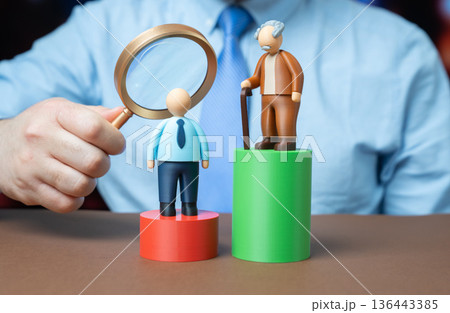 An older man is significantly ahead of a younger man on the scale. The difference in accumulated capital. The generation gap. Wealth inequality sparks dialogue on savings and mobility. An older man is significantly ahead of a younger man on the scale. The difference in accumulated capital. The generation gap. Wealth inequality sparks dialogue on savings and mobility. 136443385