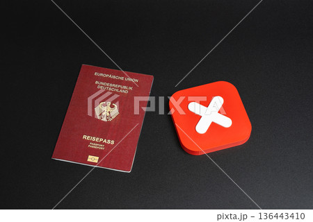 German passport and red refusal symbol. Ban on entry of citizens into the country of arrival. Ban on entry or exit. Refusal to obtain a passport or citizenship. German passport and red refusal symbol. Ban on entry of citizens into the country of arrival. Ban on entry or exit. Refusal to obtain a passport or citizenship. 136443410