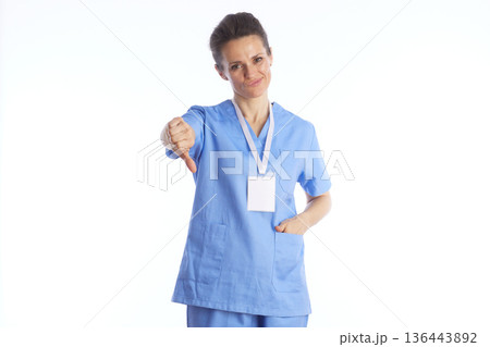 Displeased Nurse Giving Thumbs Down - Medical Disapproval Displeased Nurse Giving Thumbs Down - Medical Disapproval 136443892