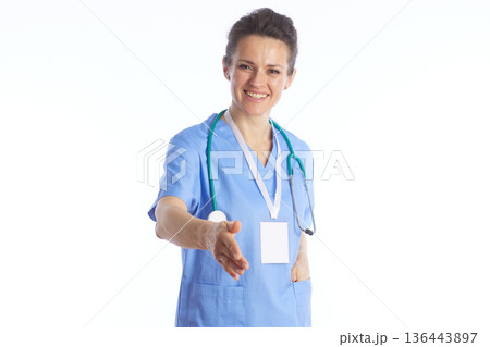 Friendly Female Doctor Offering Handshake - Professional Trust 136443897