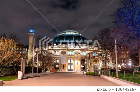 Bourse de Commerce Pinault Collection in Paris France. Historic domed architecture features the attached Medici Column illuminated at night Bourse de Commerce Pinault Collection in Paris France. Historic domed architecture features the attached Medici Column illuminated at night 136445167