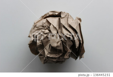 Pulp industry. Used wrapping paper ball isolated on white closeup view Pulp industry. Used wrapping paper ball isolated on white closeup view 136445231