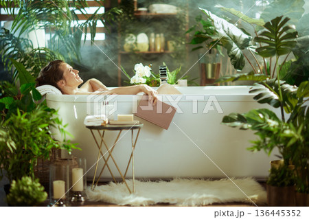 Relaxing Read in a Lush Bathroom Oasis Relaxing Read in a Lush Bathroom Oasis 136445352
