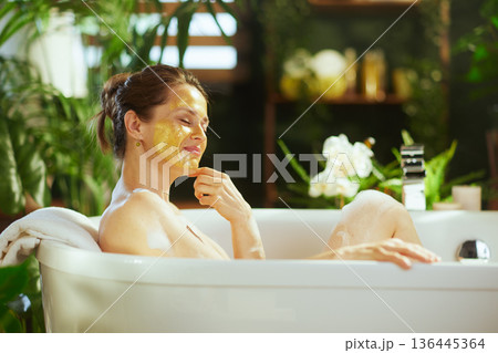 Contented Bathtub Retreat with Yellow Mask Contented Bathtub Retreat with Yellow Mask 136445364