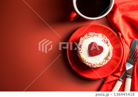 Valentine's Day, Festive red background. Cake with red heart and cup of coffee. Top view with copy space 136445418