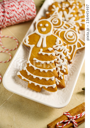 Holiday background. Christmas gingerbread cookies, festive food, home baking. Flat lay Holiday background. Christmas gingerbread cookies, festive food, home baking. Flat lay 136445497