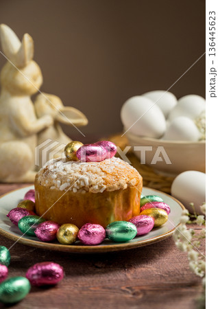Easter spring holiday background. Cake with chocolate easter eggs, gypsophila flowers and bunny Easter spring holiday background. Cake with chocolate easter eggs, gypsophila flowers and bunny 136445623