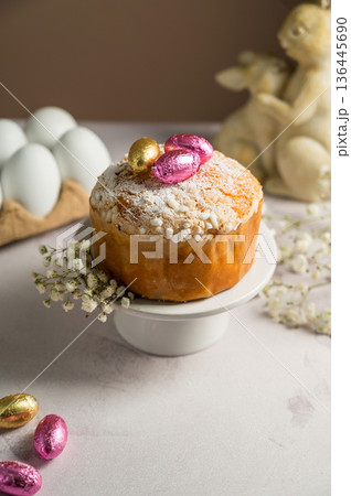 Easter cake with chocolate easter eggs, gypsophila flowers and cute bunnies. Spring holiday background. Easter cake with chocolate easter eggs, gypsophila flowers and cute bunnies. Spring holiday background. 136445690