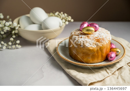 Easter cake with chocolate easter eggs, white easter eggs and gypsophila flowers. Spring holidays Easter cake with chocolate easter eggs, white easter eggs and gypsophila flowers. Spring holidays 136445697