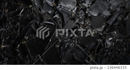 Dark obsidian stone background with glossy black glass-like surface, sharp and dramatic. Dark obsidian stone background with glossy black glass-like surface, sharp and dramatic. 136446335