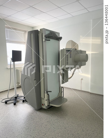 Modern Upright Xray Machine In Hospital Radiology Room. Diagnostic Imaging Equipment For Medical Examination. Modern Upright Xray Machine In Hospital Radiology Room. Diagnostic Imaging Equipment For Medical Examination. 136448001