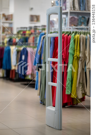 Anti-theft security gate at the entrance of a clothing store 136448158