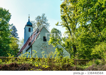 Church St.Clemens in Kranzberg near Freising, Bavaria with ancient graveyard and beautiful old wrought iron crosses 136448564