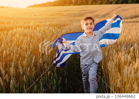 Patriot Boy Running Wheat Field Holding Greek Hellas Flag In The Wind, Homeland 136449662