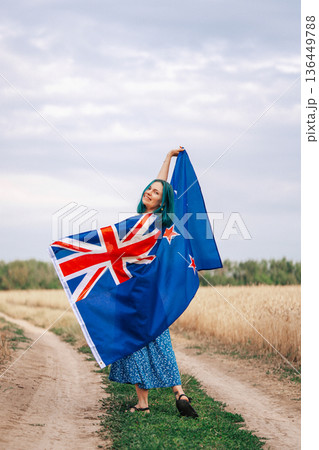 Young Woman With Vibrant Blue Hair Proudly Stands Outside Waving New Zealand Young Woman With Vibrant Blue Hair Proudly Stands Outside Waving New Zealand 136449788