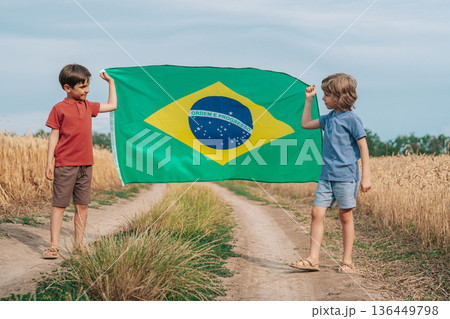 Brazilian Little Kids - Football Patriot Children With National Flag on nature field background Brazilian Little Kids - Football Patriot Children With National Flag on nature field background 136449798