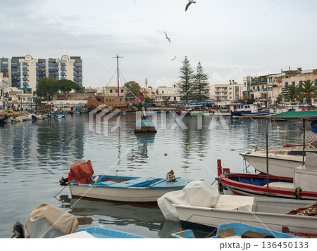 Bizerte, Tunisia - December 19, 2025: Walking along the pier of the Old Port in Bizerte, Tunisia Bizerte, Tunisia - December 19, 2025: Walking along the pier of the Old Port in Bizerte, Tunisia 136450133