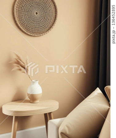 Cozy interior with decorative elements, including a vase of pampas grass and a woven wall hanging. 136452895