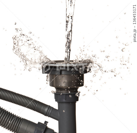 Pouring Leaking water from gray plastic pipe drain sink. Drain sink leak water from pipe plumbing in bathroom as water splash clogged drop. White background isolated Pouring Leaking water from gray plastic pipe drain sink. Drain sink leak water from pipe plumbing in bathroom as water splash clogged drop. White background isolated 136453171