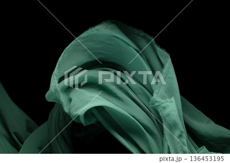 Green Organza fabric flying in curve shape, Piece of textile Green Organza fabric throw fall in air. Black background isolated, dark shading environment Green Organza fabric flying in curve shape, Piece of textile Green Organza fabric throw fall in air. Black background isolated, dark shading environment 136453195
