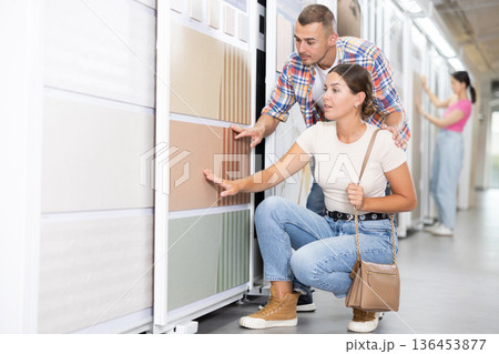 Construction store - married couple chooses ceramic flooring Construction store - married couple chooses ceramic flooring 136453877