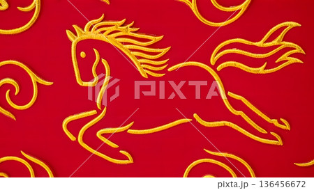 Embroidered Yellow Horse Design on Vibrant Red Fabric Background 136456672