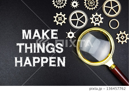 Make Things Happen text message with magnifying glass on black background 136457762