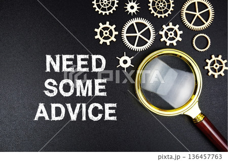 Need Some Advice text message with magnifying glass on black background Need Some Advice text message with magnifying glass on black background 136457763