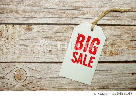 Price tag with "Big Sale" is placed on wooden background Price tag with "Big Sale" is placed on wooden background 136458147