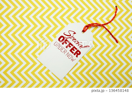 Price tag with "Special Offer Order Now" is placed on a colorful zigzag patterned background Price tag with "Special Offer Order Now" is placed on a colorful zigzag patterned background 136458148