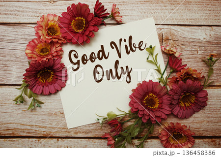 Good Vibe Only text with flowers bouquet on wooden background Good Vibe Only text with flowers bouquet on wooden background 136458386