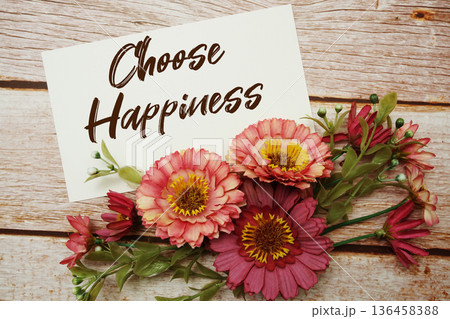Choose Happiness text with flowers bouquet on wooden background Choose Happiness text with flowers bouquet on wooden background 136458388