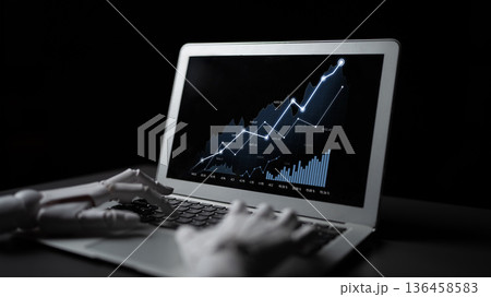 Close-up of a robotic hand interacting with a laptop displaying a digital financial chart showcasing growth and statistics on a dark background Scalp 136458583