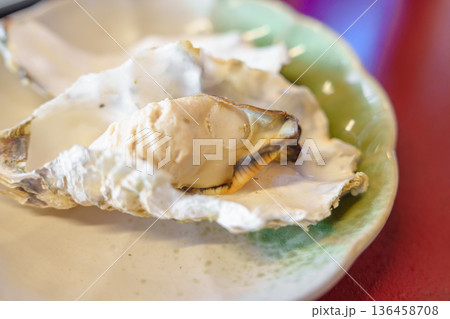 grilled Oyster in Matsushima fish market, seafood famous and popular of Matsushima bay in Miyagi Prefecture, Tohoku, Japan grilled Oyster in Matsushima fish market, seafood famous and popular of Matsushima bay in Miyagi Prefecture, Tohoku, Japan 136458708