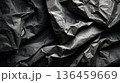 Crumpled black paper texture with soft shadow wrinkles 136459669