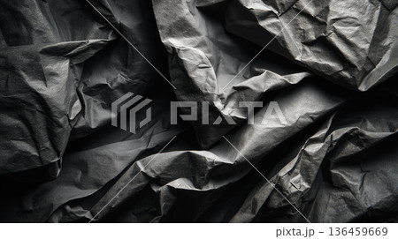 Crumpled black paper texture with soft shadow wrinkles Crumpled black paper texture with soft shadow wrinkles 136459669